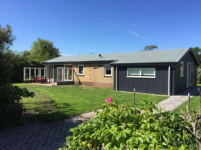 Отель Detached bungalow situated directly at a large sand dunes and nature area  Балум